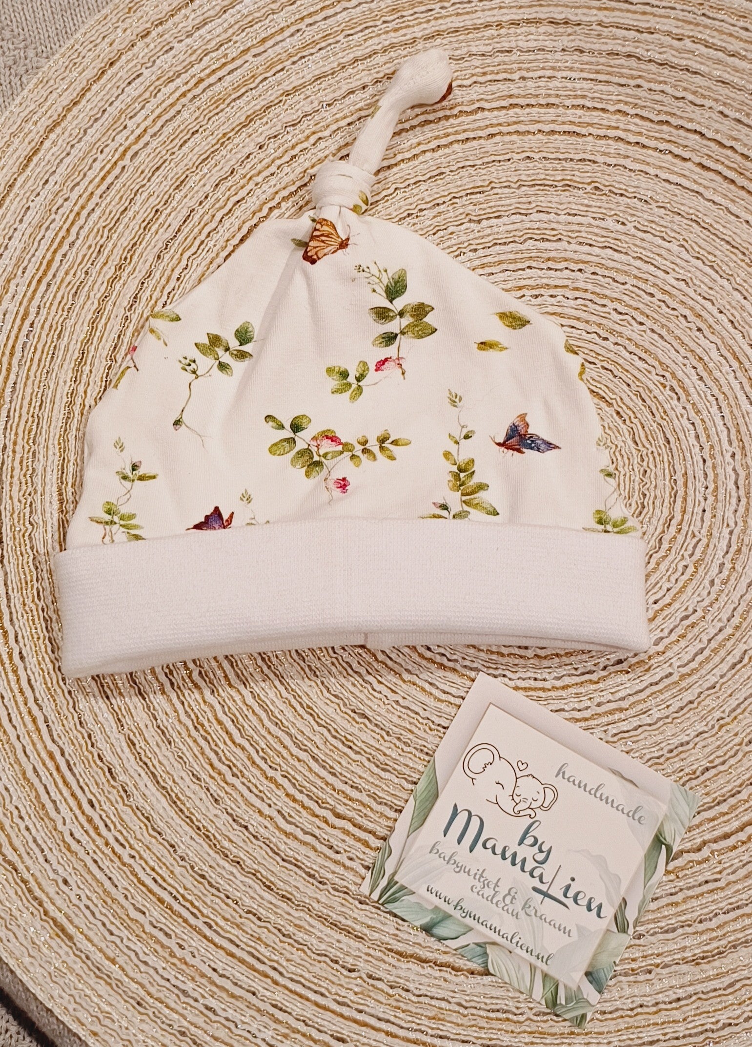 Baby knoopmutsje vrolijke vlinders