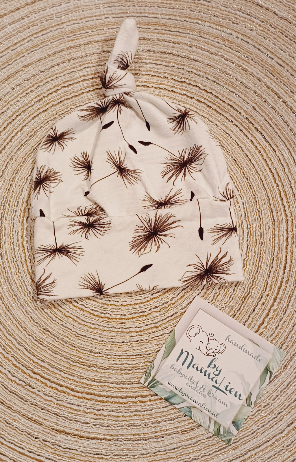 Baby knoopmutsje donkere pluis bloemen