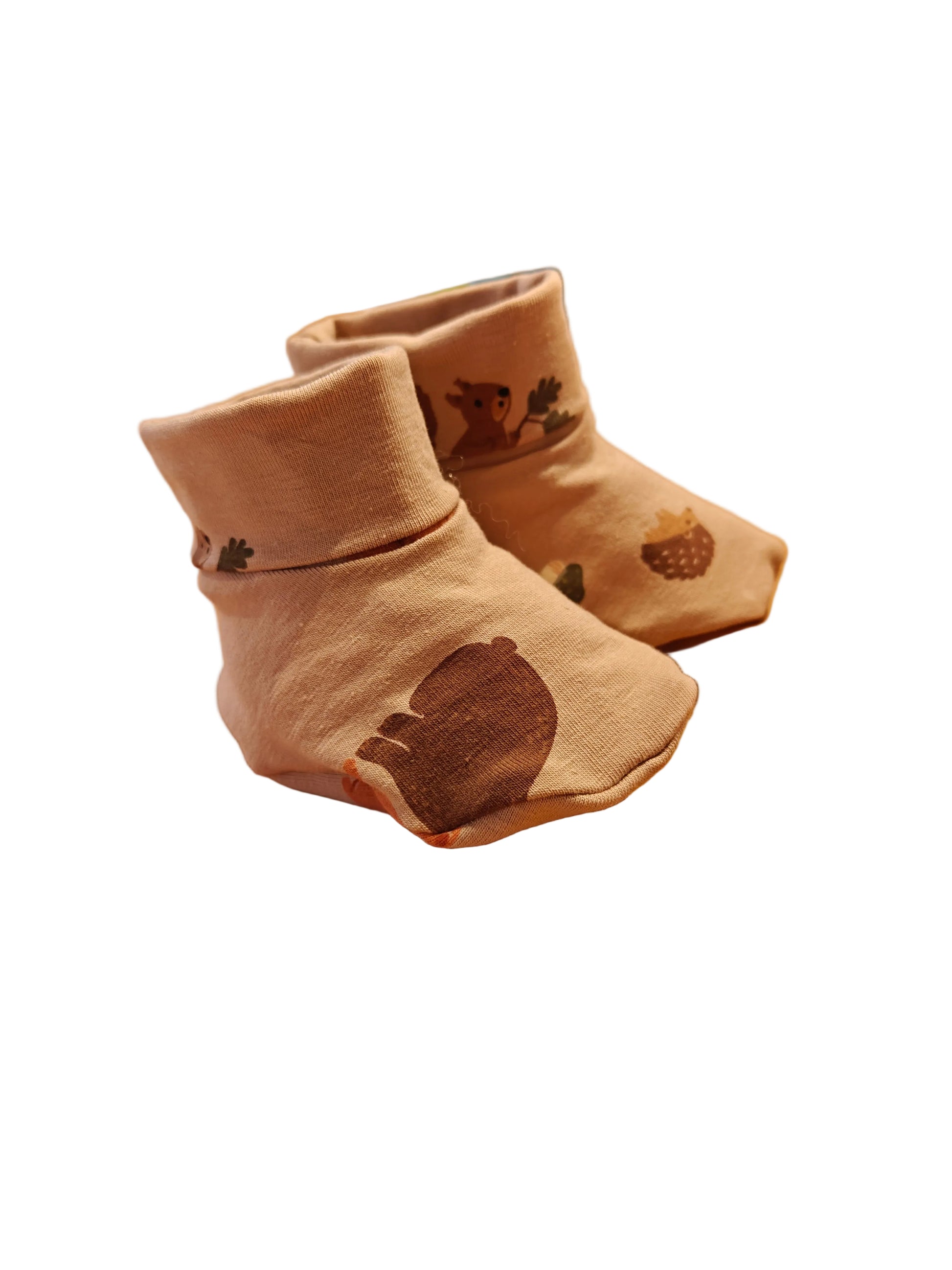 Baby slofjes hefst zand